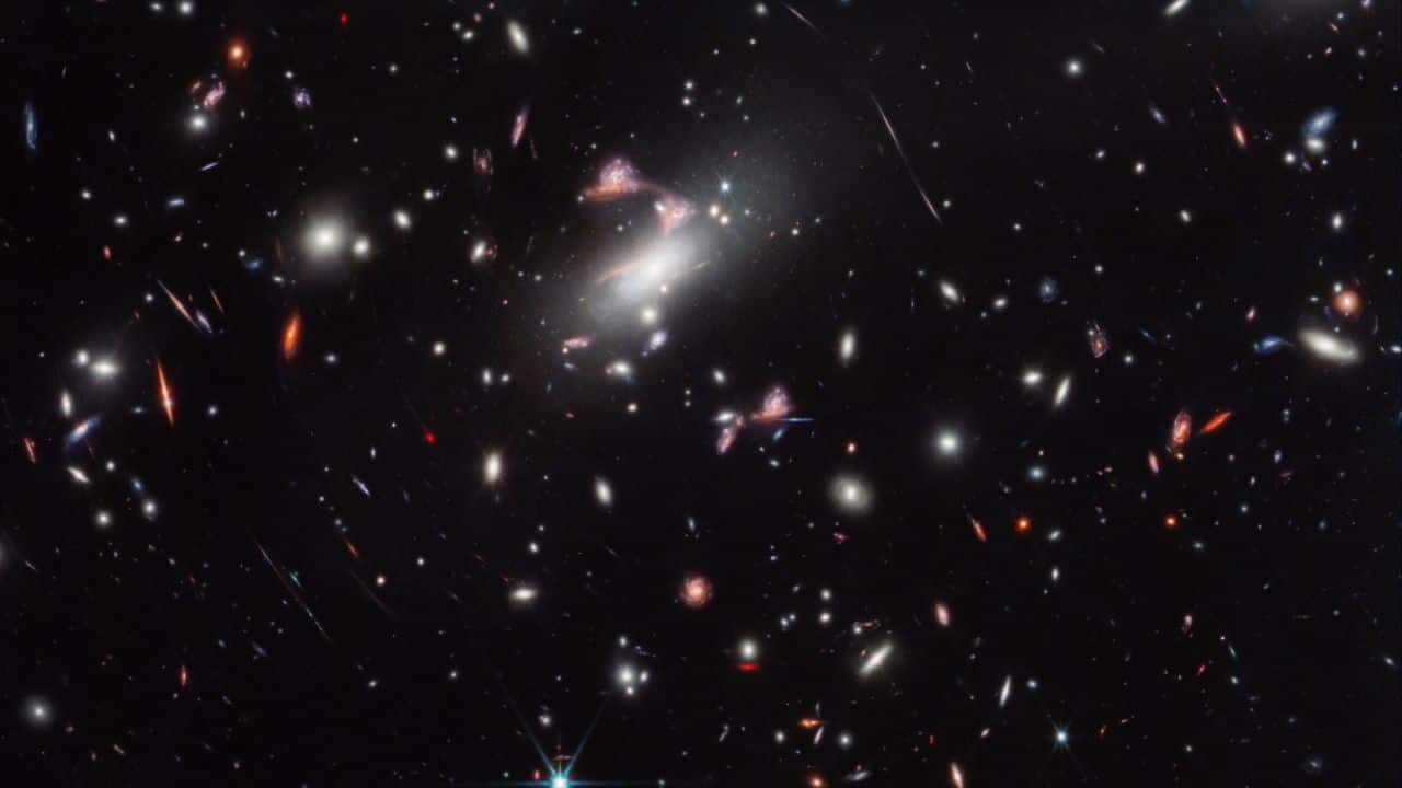 NASA’s Webb captures distorted galaxy forming cosmic question mark; check out the stunning images