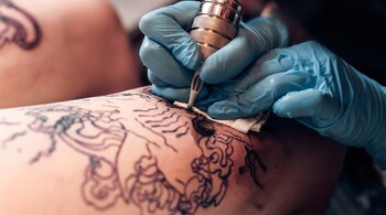 Health risks of tattoos: Unclean practices can result in allergic reactions to inks or equipment, leading to longer healing times or scarring (Image: Canva)