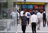 Asian stocks edge up, euro falls on French concern