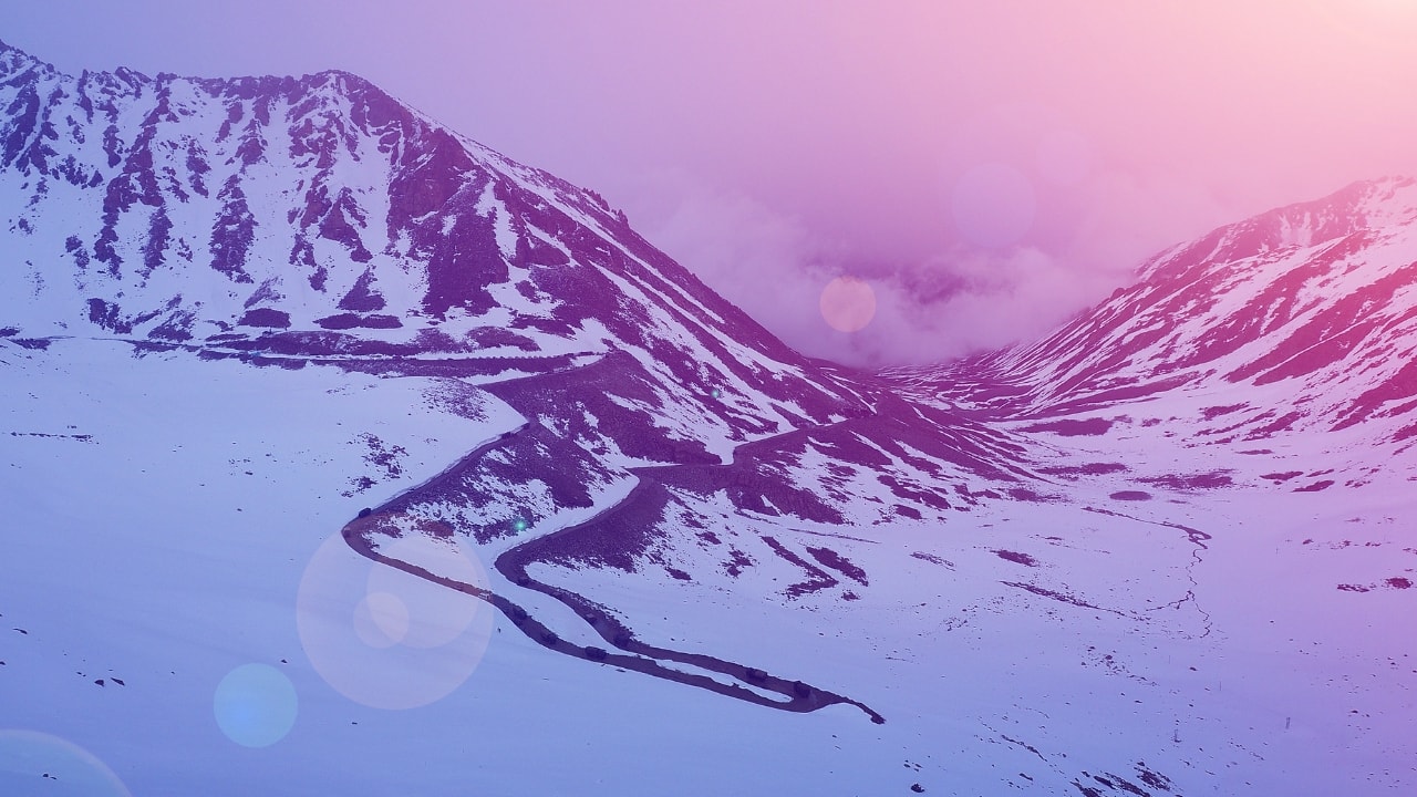 1. Khardung La Pass – Ride Above the Clouds Ever dreamed of riding through the sky? At 18,379 feet, Khardung La is one of the world’s highest motorable passes, offering a surreal biking experience. You’ll feel on top of the world—literally—as you weave through this iconic pass, taking in the stunning panorama of the Leh-Ladakh region. The road might be rugged, but the views are worth every bump. (Image: Canva) Best Time to Visit: April to June and September to October What’s Special: Jaw-dropping views of the Leh-Ladakh region