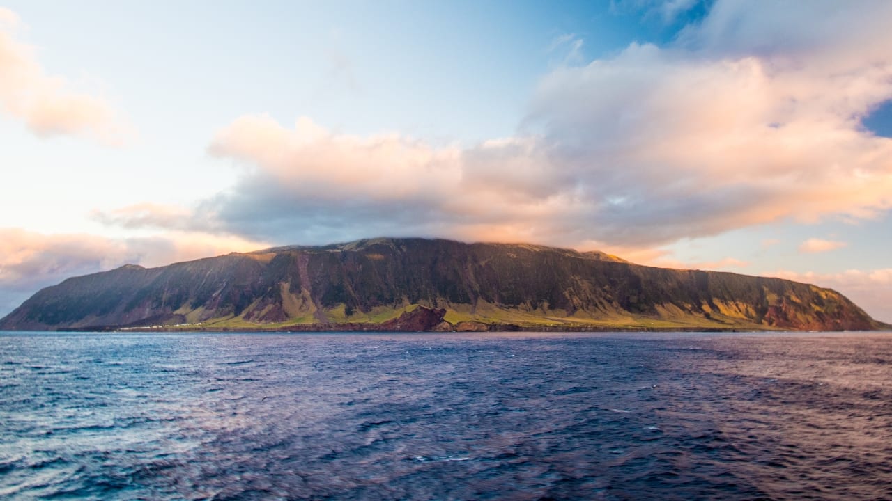 1. Tristan da Cunha, South Atlantic Ocean | Nestled in the South Atlantic, Tristan da Cunha is the most remote inhabited archipelago on Earth. Its volcanic landscapes, breathtaking cliffs, and a close-knit community offer a tranquil retreat where nature’s beauty reigns supreme. The isolation ensures a serene escape from modern life, perfect for those seeking solitude.(Image: Canva)