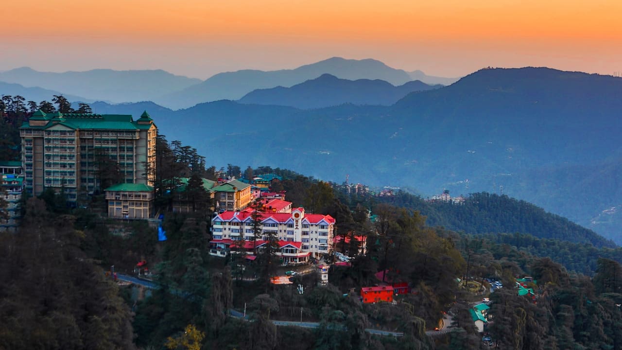 2. Shimla, Himachal Pradesh | Shimla, the capital of Himachal Pradesh, is renowned for its charming colonial architecture and panoramic mountain views. The vistadome coach journey to Shimla offers spectacular views of snow-capped peaks and dense forests, letting you soak in the natural splendor of this popular hill station. (Image: Canva)