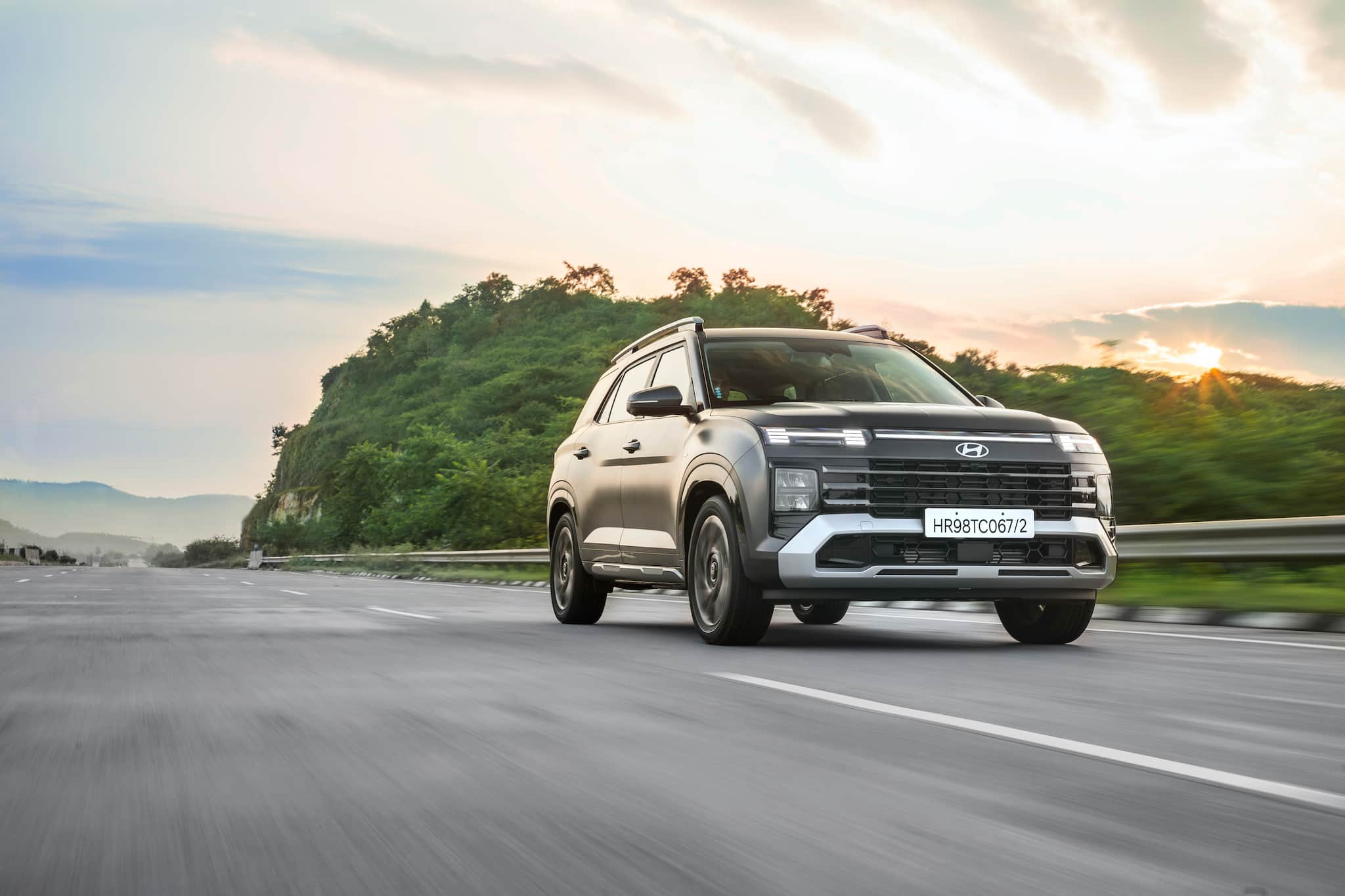 Key Features and Comfort Enhancements: Alcazar showcases a range of impressive features, including a premium cabin equipped with twin TFT units, a digital dashboard, and seamless smartphone connectivity. For passenger comfort, it offers ventilated seats, a panoramic sunroof, and dual-zone climate control. Safety is prioritized with multiple airbags and Advanced Driver Assistance Systems (ADAS) Level 2. Additional features include a 360-degree camera, wireless charging, navigation, and Bluelink connected car technology with over 70 capabilities. Key Features and Comfort Enhancements: Alcazar showcases a range of impressive features, including a premium cabin equipped with twin TFT units, a digital dashboard, and seamless smartphone connectivity. For passenger comfort, it offers ventilated seats, a panoramic sunroof, and dual-zone climate control. Safety is prioritized with multiple airbags and Advanced Driver Assistance Systems (ADAS) Level 2. Additional features include a 360-degree camera, wireless charging, navigation, and Bluelink connected car technology with over 70 capabilities.