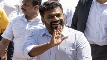 Anura Kumara Dissanayake greets supporters at a polling station during the presidential election in Colombo on Sept. 21. (Image - Bloomberg)