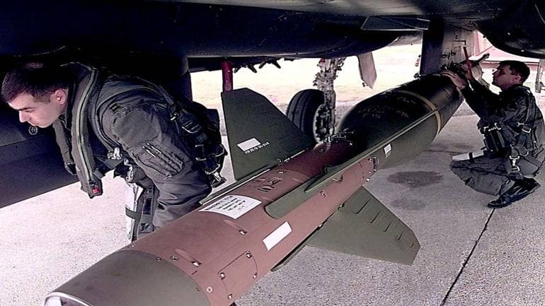 This US Air Force file image obtained 12 March, 2003, shows pilots checking the GBU-28 "bunker Buster",a 4000 pound bomb designed to penetrate hardened targets before exploding. (Photo courtesy: AFP)