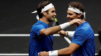 Roger Federer and Rafa Nadal share a hug
