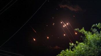 File: Missiles launched from Iran towards Israel streak across the night sky (AP)