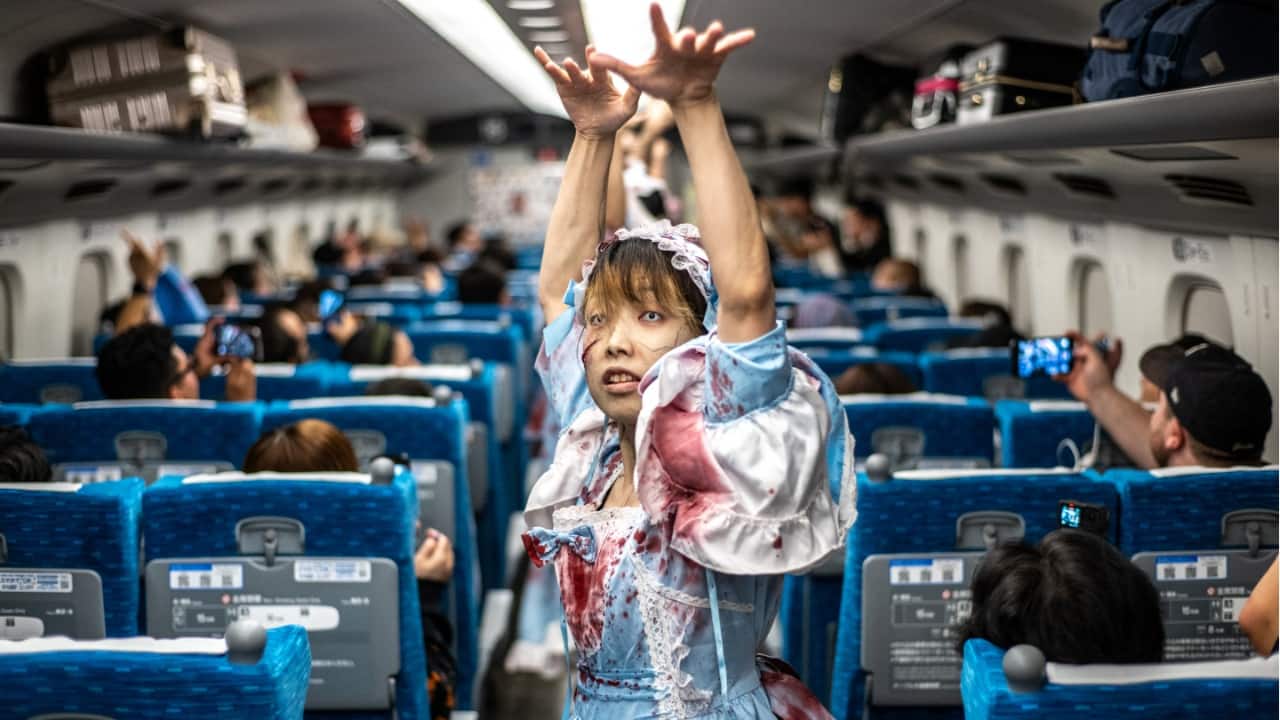 An actor performer for passengers during the 'Zombie Shinkansen' event on a bullet train from Tokyo to Osaka, ahead of Halloween on October 19. (Image credit: AFP)