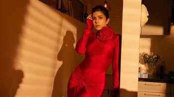 Nimrat Kaur looked absolutely stunning in a red bodycon dress that featured a delicate rose embellishment near the neckline, adding a touch of elegance to her look.