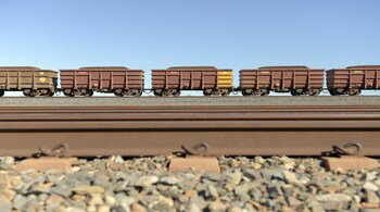 A freight train carrying iron ore travels along a track near a Rio Tinto Group rail yard in Karratha, Western Australia, Australia, on Wednesday, June 22, 2022. Iron ore is on course to end the week lower, with the increase in Chinese steel plants being idled and swelling inventories seen as signs of stagnant demand. Photographer: Carla Gottgens/Bloomberg