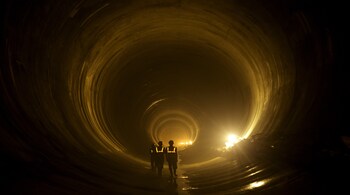 WANGDUEPHODRANG, BHUTAN - SEPTEMBER 04: Workers inside tunnel at Punatsangchhu-I Hydroelectric Project in Bhutan on September 4, 2013. The project, which will have a capacity of 1200 MW, is the first of a series of 10 hydropower projects jointly identified by India &amp; Bhutan and to be implemented for a total installed capacity of 11,576 MW by 2020. (Photo by Kuni Takahashi/Getty Images)