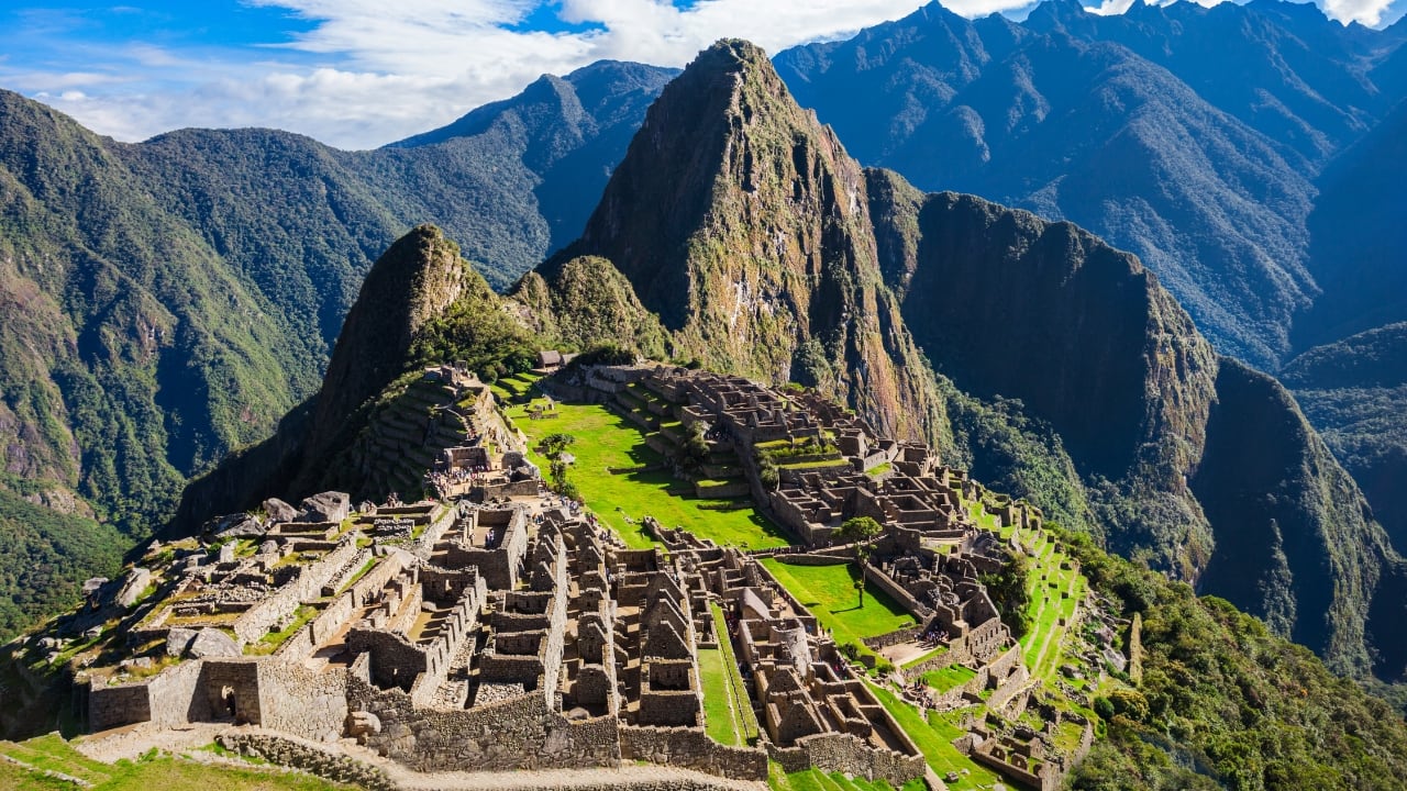 Explore Peru’s mystical Machu Picchu, a lost city nestled in the Andean peaks. (Image: Canva)