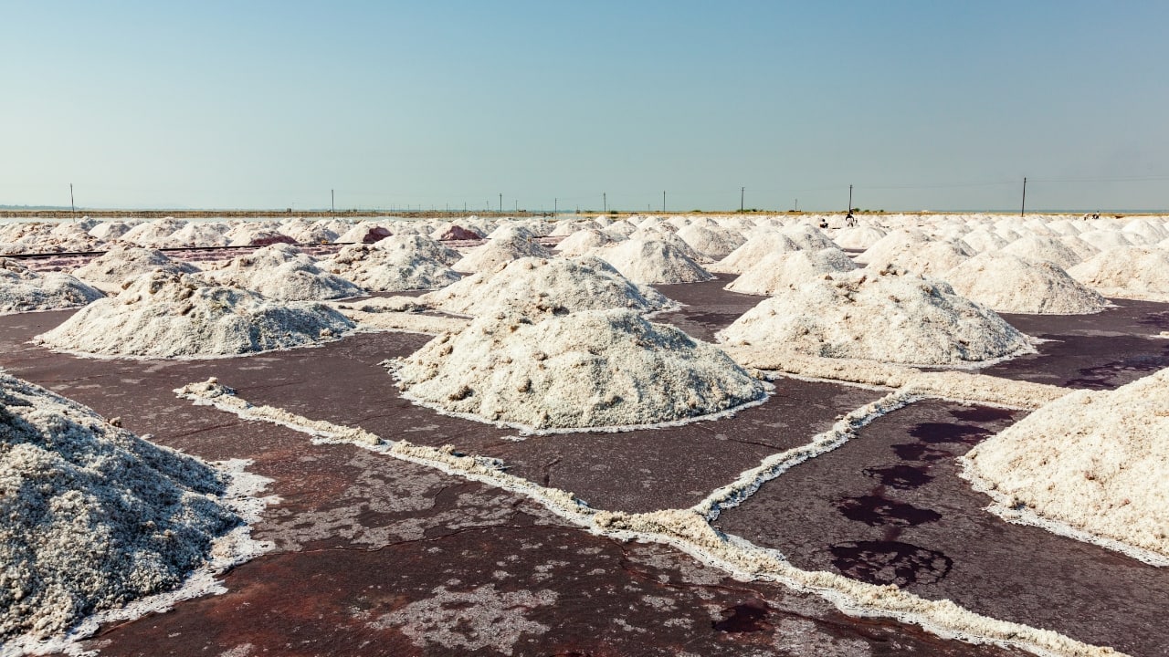 A shimmering salt lake with pink waters, offering an ethereal sunrise and sunset experience. (Image: Canva)