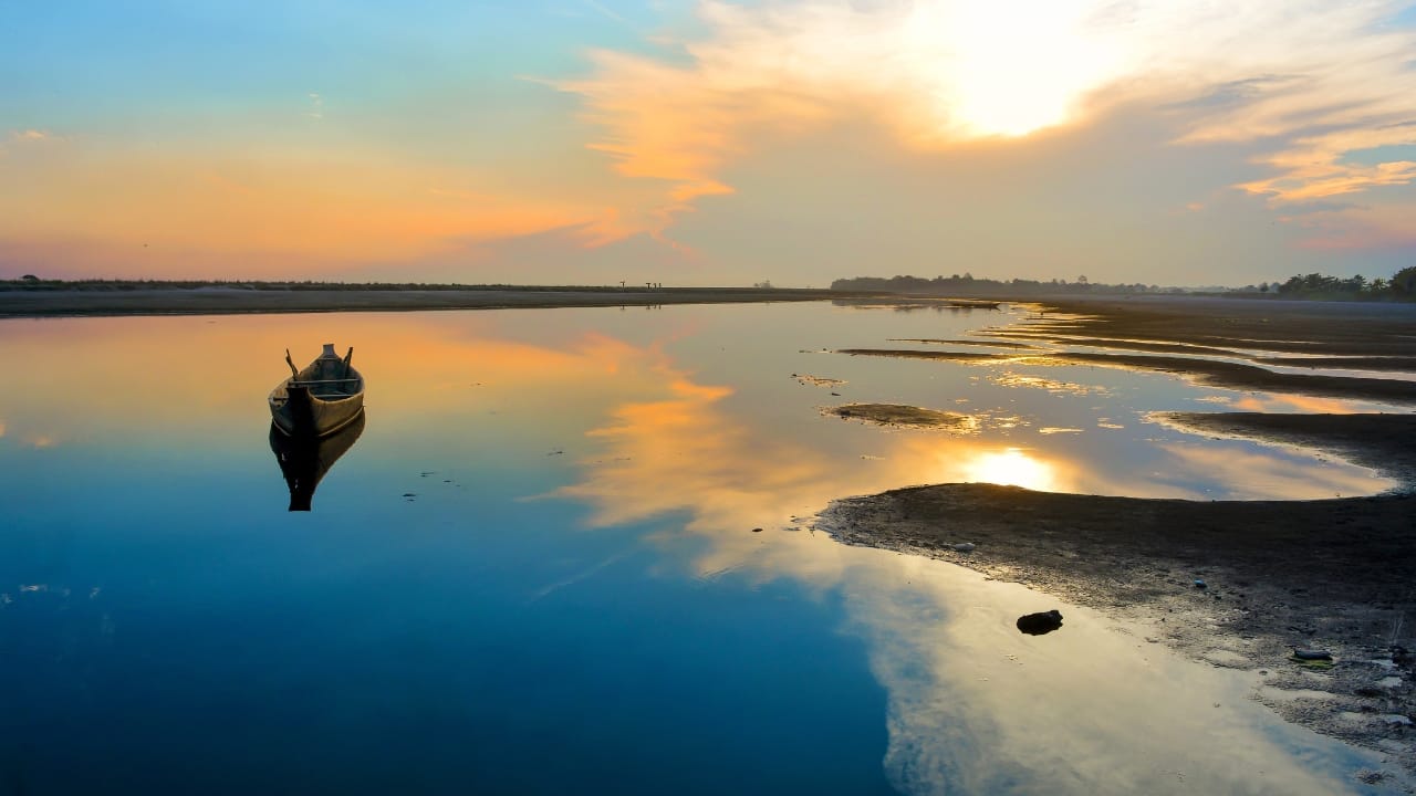 India’s largest river island, Majuli, offers lush greenery and unique cultural heritage. (Image: Canva)