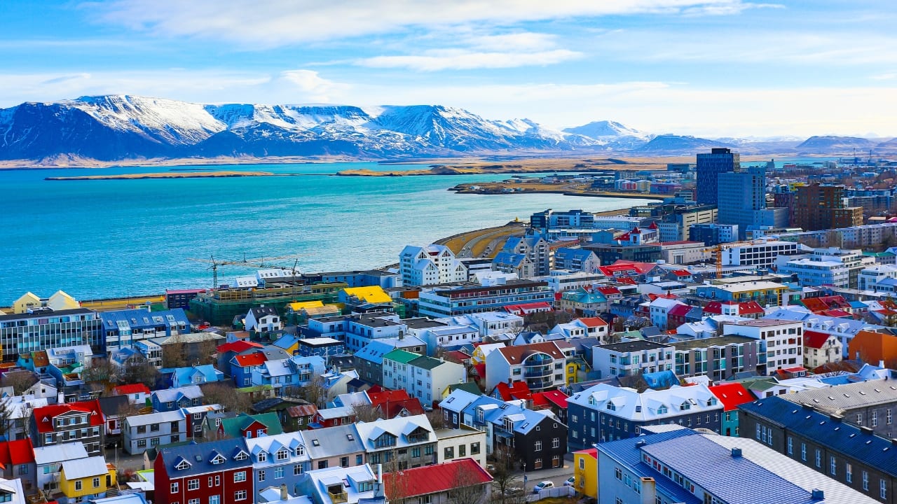 Explore Reykjavik's vibrant streets and green spaces for a sustainable, romantic escape. (Image: Canva)