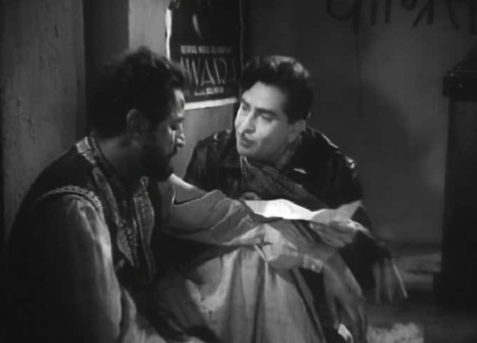 Raj Kapoor with Pran (left) in 'Chhalia' (1960).