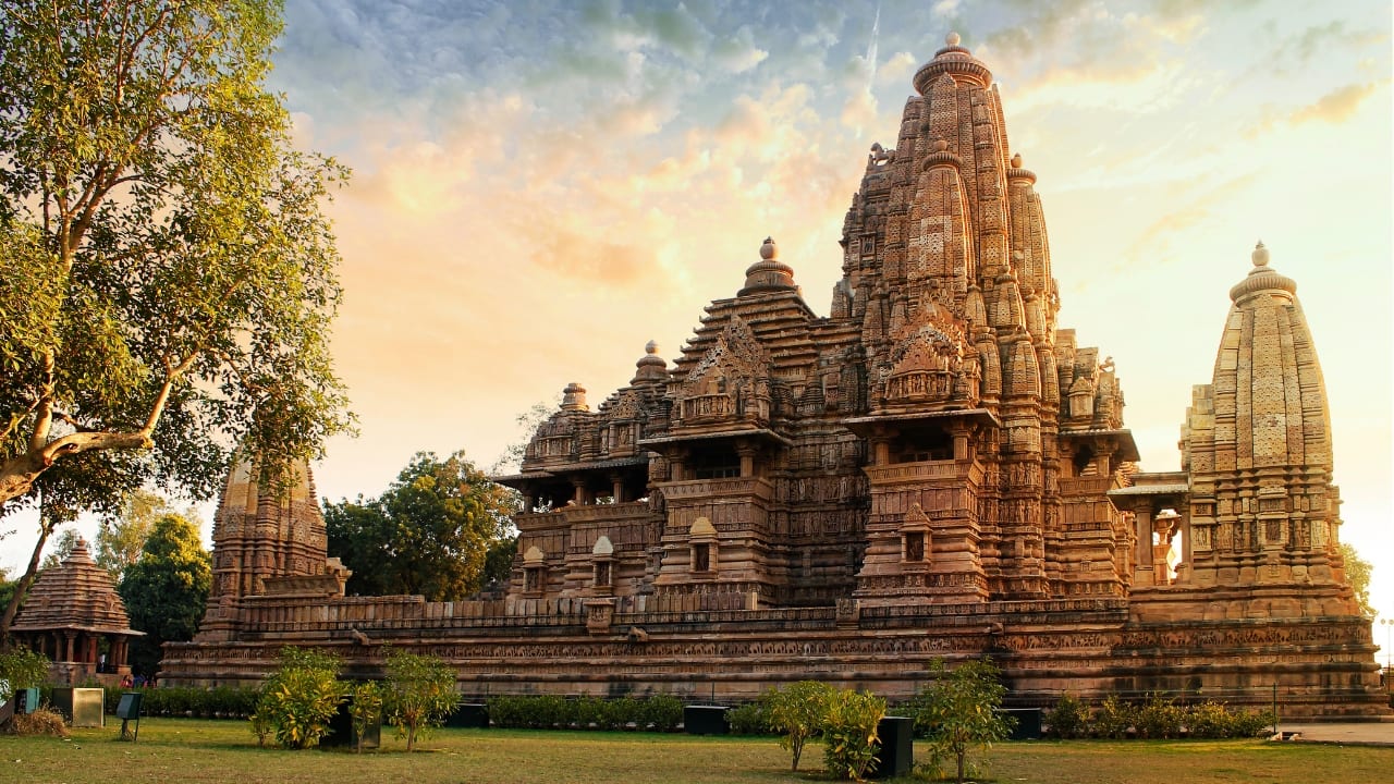 Explore the ancient temples and mesmerizing architecture of Khajuraho on a budget-friendly getaway. (Image: Canva)