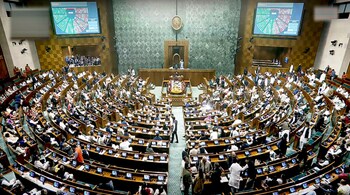 Members during electronic voting after which two bills that lay down the mechanism to hold simultaneous elections, were introduced in the Lok Sabha during the Winter session of Parliament. (PTI)