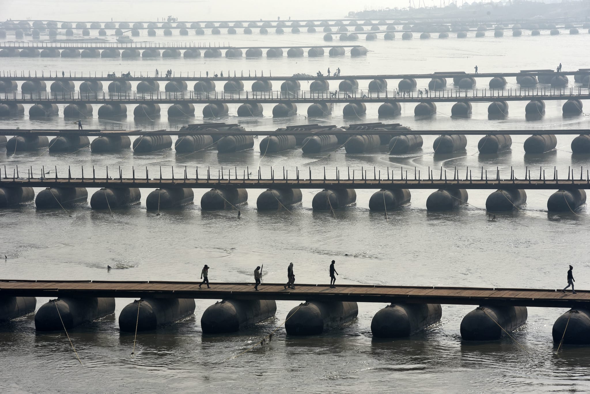 Labourers works as they build floating pontoon bridges over the river Ganges for the preparation of the Mahakumbh Festival in 2025 near Sangam,in Prayagraj on Monday, December 02, 2024.Photo by Amar Deep Sharma: PD100023