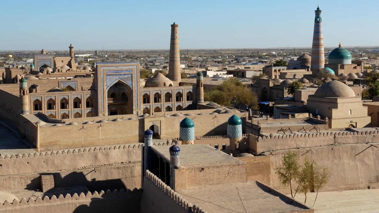 Khiva's Itchan Kala complex offers a captivating journey through ancient history. (Image: Canva)