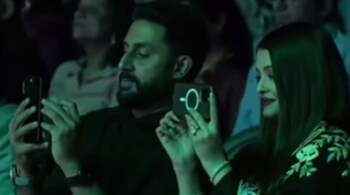 Abhishek Bachchan and Aishwarya Rai Bachchan recording their daughter