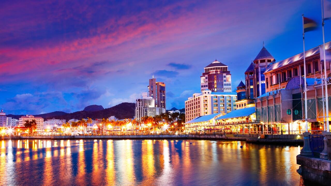 Escape to Mauritius for a tropical New Year celebration, enjoying 90 days of visa-free bliss on stunning beaches. (Image: Canva)