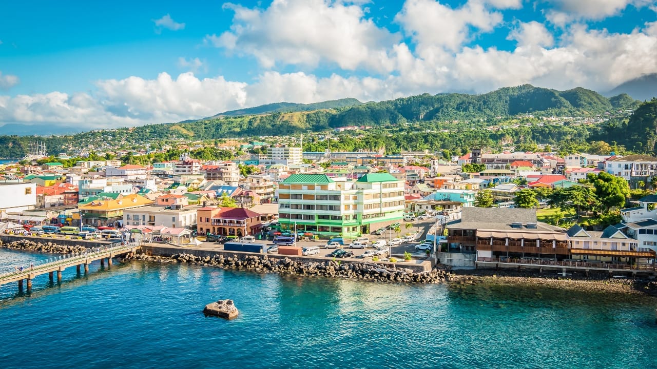Unwind on Dominica's lush "Nature Island," offering 180 days of visa-free stay amidst pristine nature. (Image: Canva)