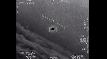 The image from video provided by the Department of Defense labelled Gimbal, from 2015, an unexplained object is seen at center as it is tracked as it soars high along the clouds, traveling against the wind.