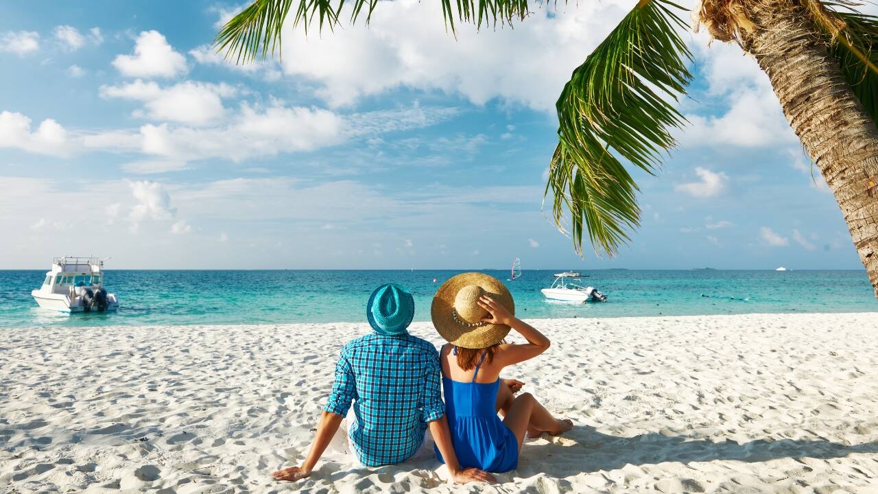 Pristine beaches and luxury resorts – The Maldives offers the ultimate romantic getaway. (Image: Canva)