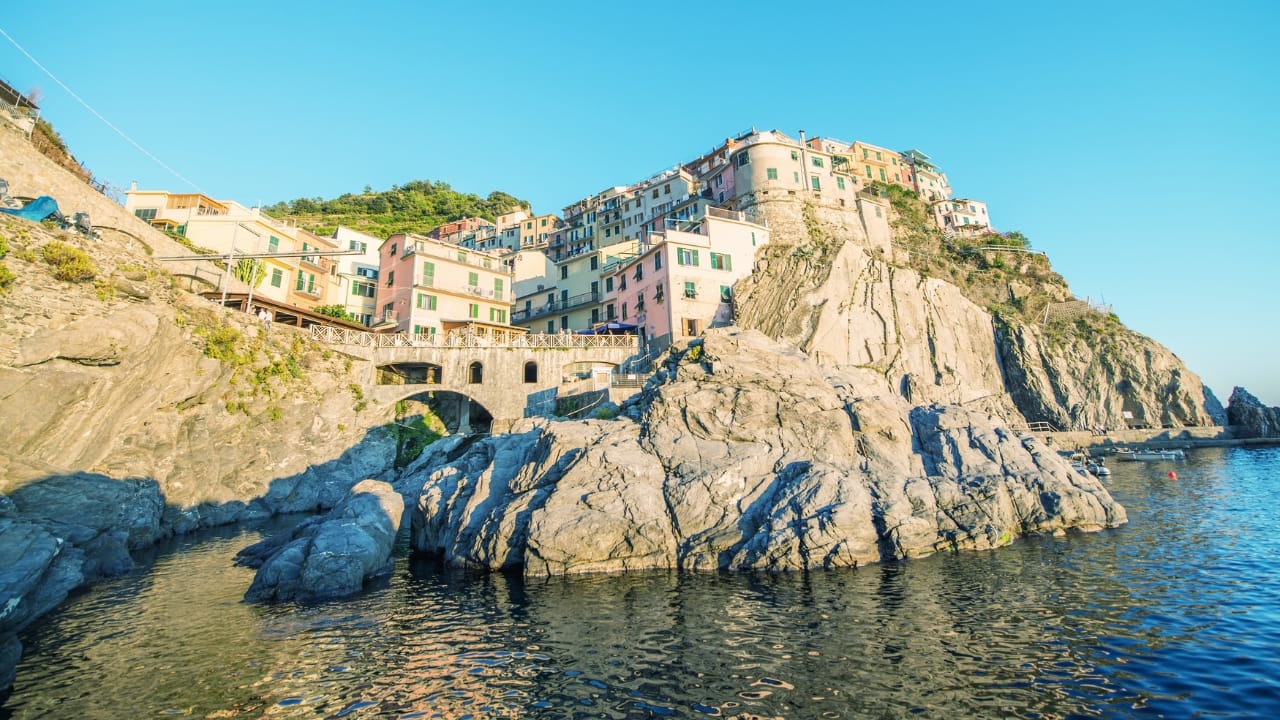 7. Cinque Terre The five picturesque villages of Cinque Terre, perched on Italy’s rugged coastline, are a must for nature lovers and adventure seekers. Hike along scenic trails, marvel at the dramatic cliffs, and unwind in colorful villages that offer a perfect blend of Italian charm and natural splendor. (Image: Canva)
