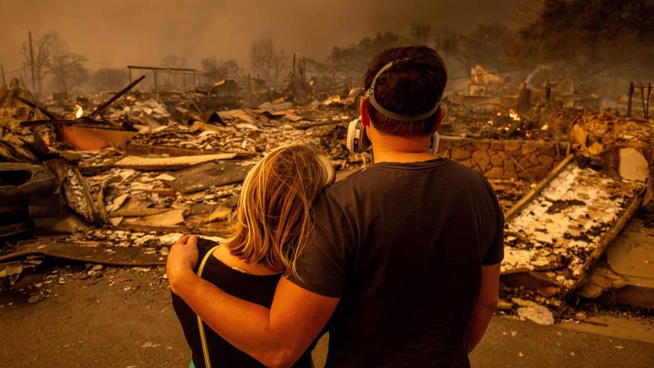 CALIFORNIA WILDFIRES 2025: Megan Mantia and her boyfriend Thomas return to Mantia's fire-damaged home after the Eaton Fire swept through Altadena on Wednesday, Jan. 8, 2025. (Image: AP)