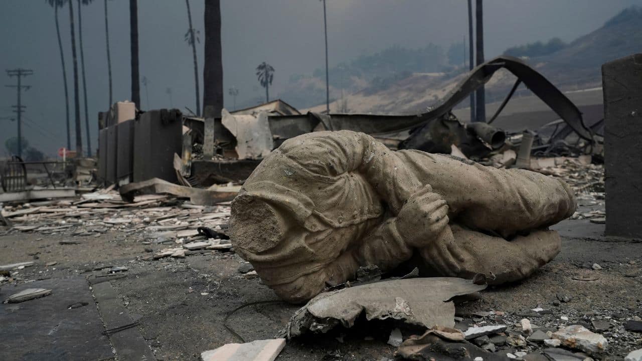 CALIFORNIA WILDFIRES 2025: A statue and several structures are destroyed as the Palisades Fire sweeps through the Pacific Palisades neighbourhood in Los Angeles, Wednesday, Jan. 8, 2025. (Image: AP)
