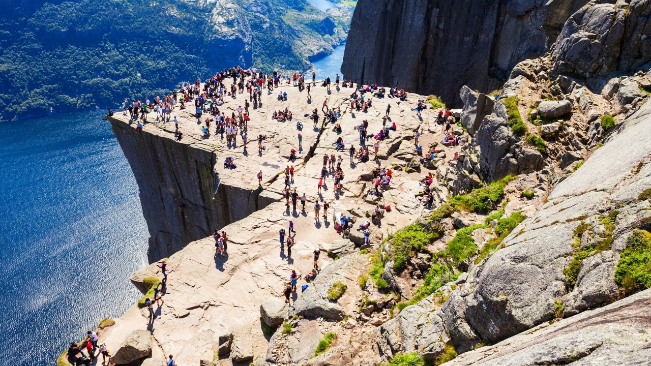 3. Preikestolen (Pulpit Rock), Norway Standing 1,900 feet above a fjord, Pulpit Rock offers breathtaking views of Norway’s natural beauty. Hike up for a truly exhilarating experience, with expansive views and a feeling of being on top of the world. (Image: Canva)