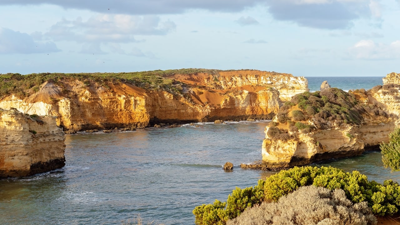6. Great Ocean Road Cliffs, Australia Home to the famous Twelve Apostles, the cliffs along the Great Ocean Road rise dramatically from the Southern Ocean. These towering limestone formations, especially at sunset, are a photographer’s dream. (Image: Canva)