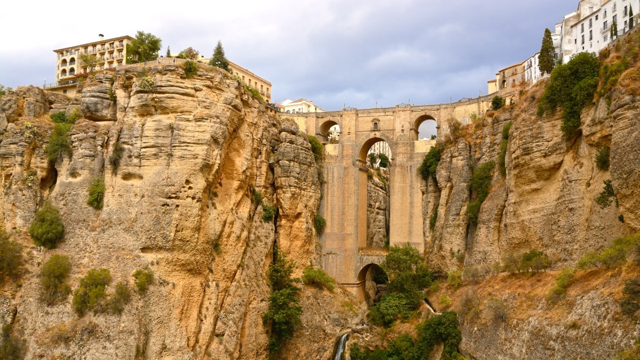 9. Ronda, Spain The cliffs of Ronda, perched above a deep gorge, are a breathtaking sight. The town’s famous Puente Nuevo bridge connects the two halves of Ronda, providing one of the most stunning views in Spain. (Image: Canva)