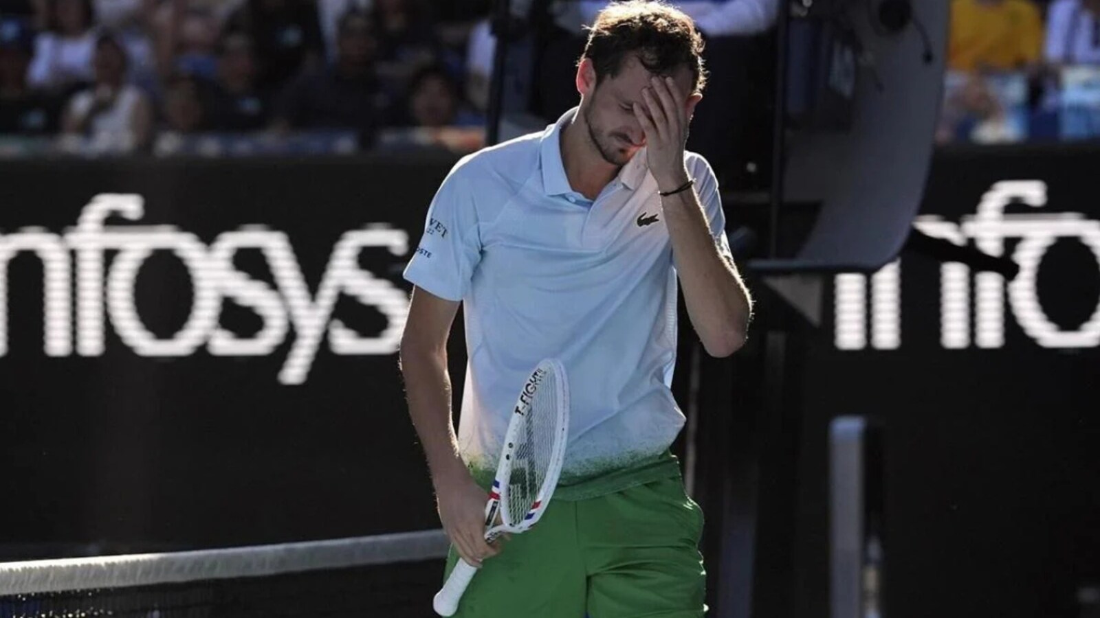 Daniil Medvedev destroys a camera attached to the net at the Australian Open