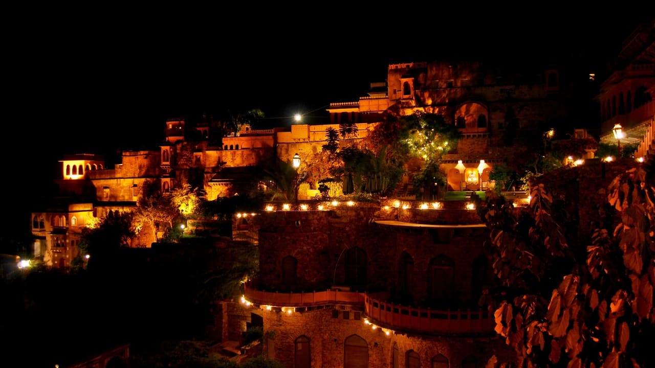 5. Neemrana: Located just 2 hours from Delhi, Neemrana offers an unmatched heritage experience. Stay at the Neemrana Fort-Palace, enjoy zip-lining, and explore the fort’s fascinating history and architecture. The royal hospitality and views make it an unforgettable getaway. (Image: Canva)