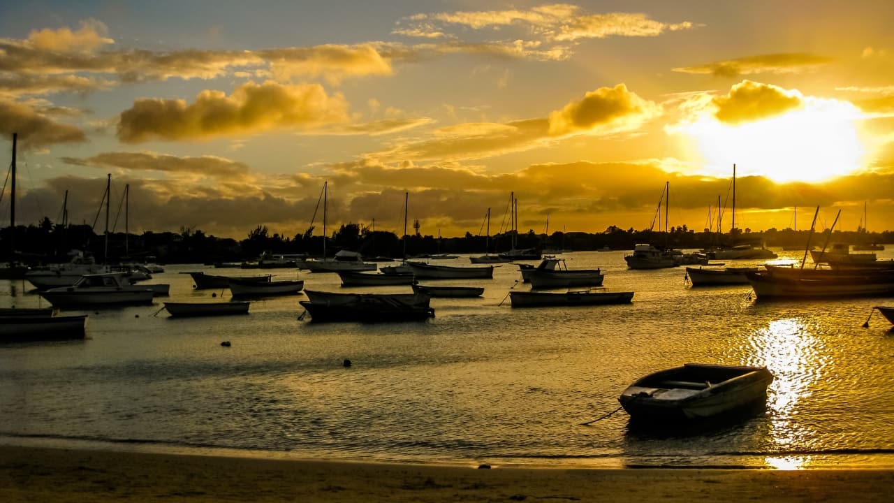 1. Sunset Cruise in Grand Baie Embark on a romantic sunset cruise along the shimmering coast of Grand Baie. This peaceful and picturesque excursion offers a perfect opportunity to enjoy Mauritius’ stunning scenery while sipping on champagne with your loved one. (Image: Canva)
