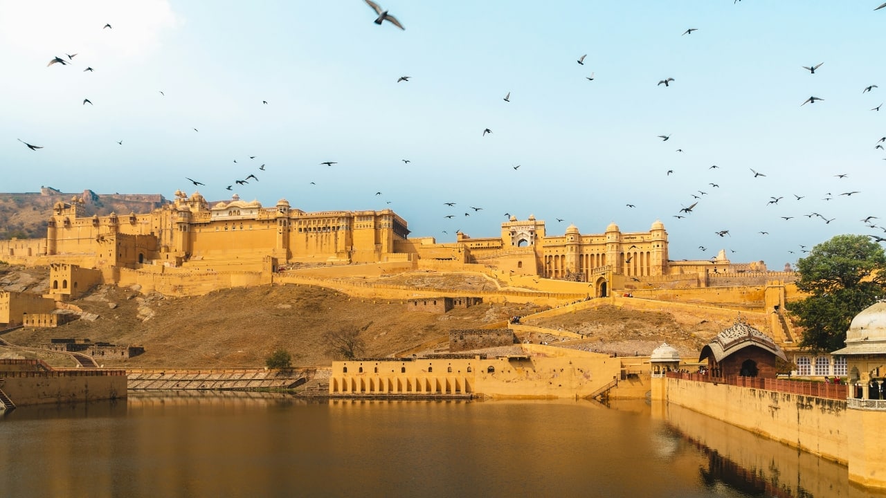 1. Fall in Love with India’s Majestic Forts and Palaces India’s forts and palaces are straight out of a fairy tale. From Rajasthan’s grand Amber Fort to Delhi’s ancient Red Fort, these romantic landmarks are perfect for history buffs and dreamers alike. Explore the opulent interiors of the palaces, walk along grand courtyards, and let the stories of India’s royal past sweep you away. (Image: Unsplash)