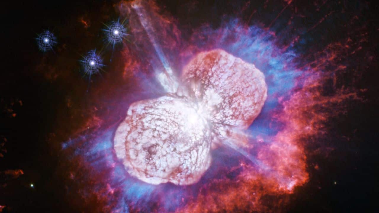 THE ETA CARINAE NEBULA: A turbulent, star-forming region, 7,500 light-years away, surrounding the volatile, massive star Eta Carinae, featuring vibrant colors and dynamic textures. (Image: NASA)
