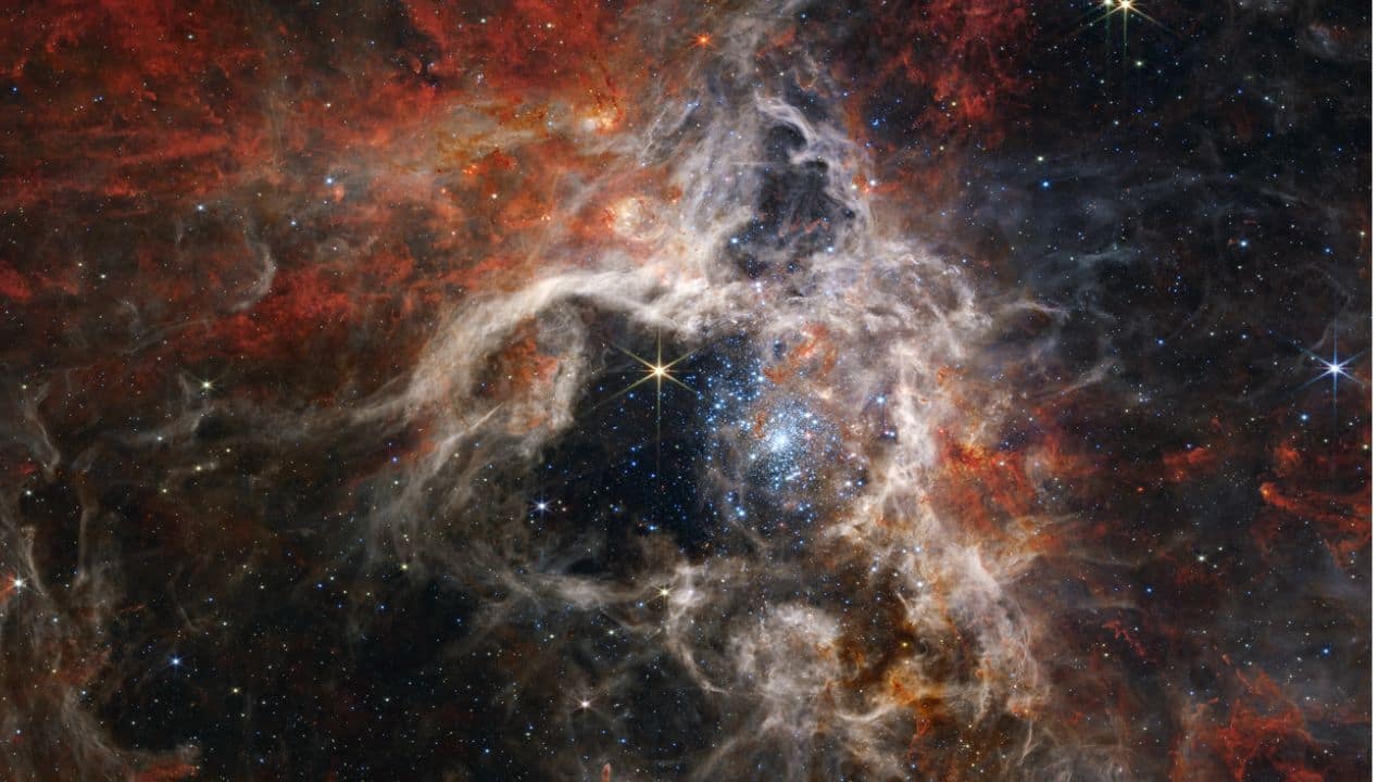 THE TARANTULA NEBULA: A vast, star-forming region, 160,000 light-years away, in the Large Magellanic Cloud, showcasing a stunning array of stars, gas, and dust. (Image: NASA)