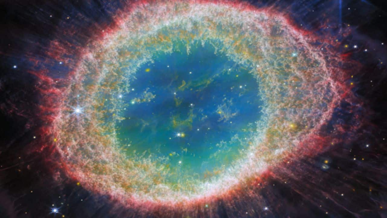 THE RING NEBULA: A stunning planetary nebula, 2,300 light-years away, formed by a dying star's expelled gas, featuring a vibrant, glowing ring of gas and dust. (Image: NASA)
