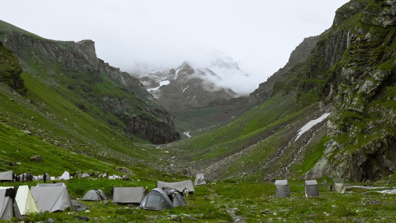 9. Hampta Pass Trek Want to explore the Himalayas like never before? The Hampta Pass trek offers diverse landscapes, from lush valleys to snowy peaks, and lets you traverse the majestic Pir Panjal range in the middle of winter. (Image: Canva)