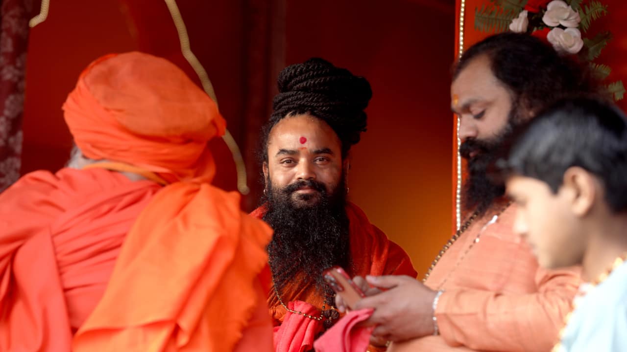Babas Immersed in Rituals: Sadhus and babas performing poojas and rituals at the riverbanks create a divine aura. Their chants and offerings reflect deep devotion and add to the spiritual energy of the Kumbh. (Image: Sanjit Kumar)