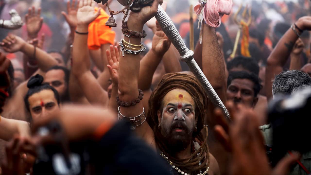 Awe-Inspiring Naga Sadhus: Naga Sadhus, known for their austere lifestyle, are a unique attraction at the Kumbh. Their ash-smeared bodies and spiritual practices draw immense attention and respect. (Image: Sanjit Kumar)