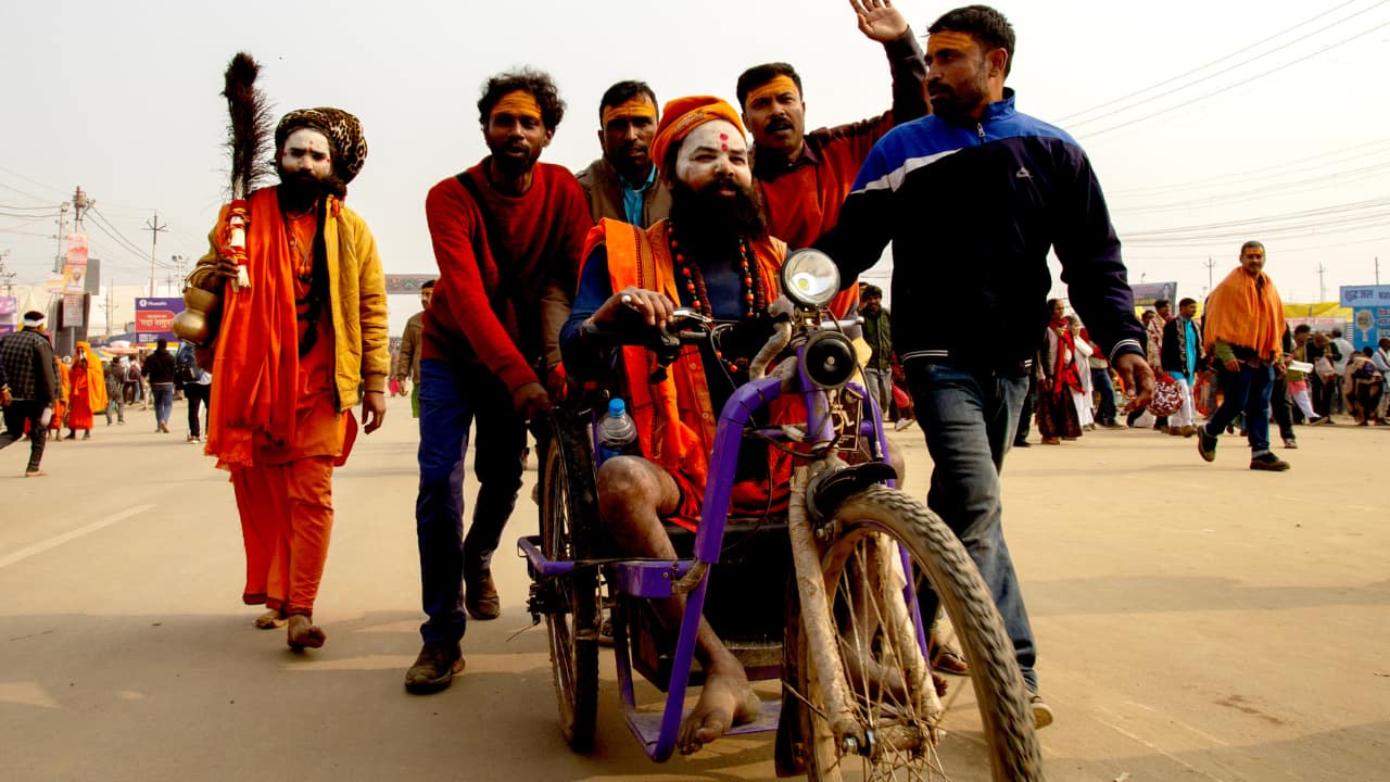 Devotees Enjoying the Festivities: Devotees at the Maha Kumbh are seen immersed in joy, celebrating the spiritual atmosphere, participating in rituals, and cherishing the sense of community that defines this grand festival. (Image: Sanjit Kumar)