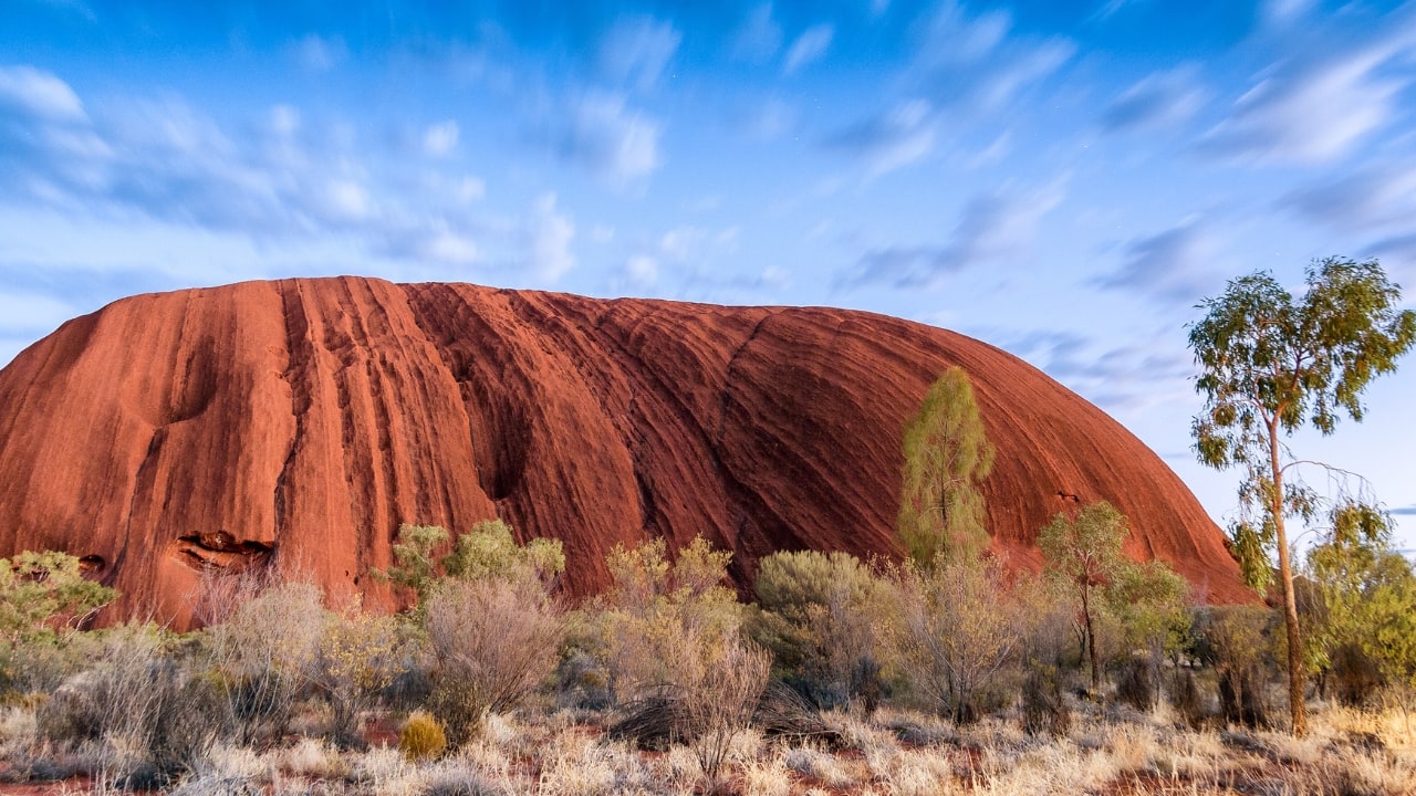 3. The Outback, Australia Vast, red-hued expanses and unspoiled natural beauty define Australia’s Outback. Whether you’re stargazing under crystal-clear skies or exploring ancient Aboriginal sites, the Outback offers a profound sense of isolation and wonder. (Image: Canva)