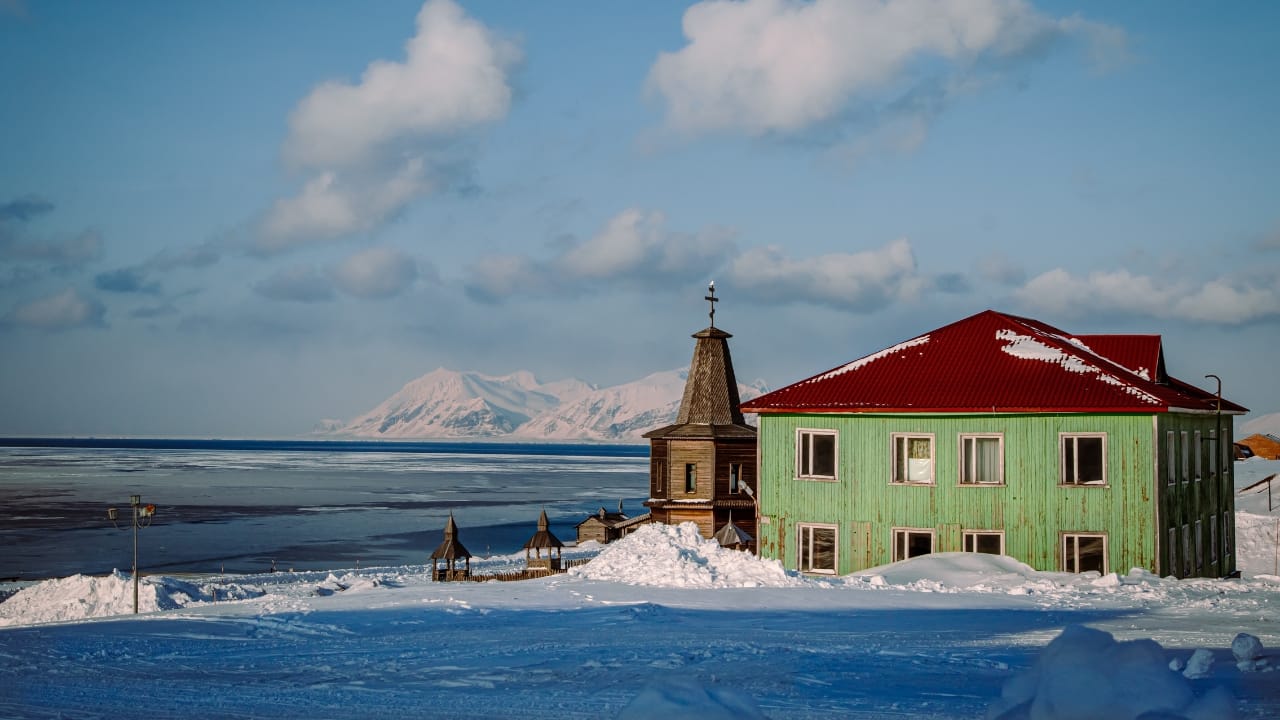 10. Svalbard, Norway One of the northernmost inhabited places on Earth, Svalbard is a land of polar bears, glaciers, and the mesmerizing Northern Lights. Its remoteness and natural beauty make it an extraordinary destination to truly disconnect. (Image: Canva)