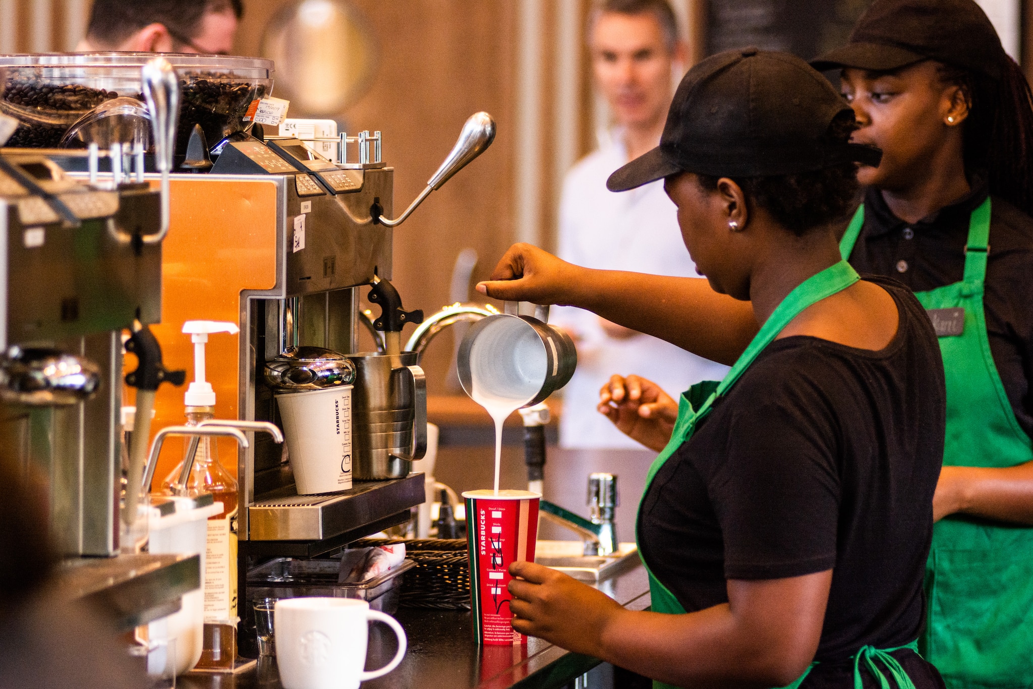 Starbucks turnaround bid shows progress with sales slump easing
