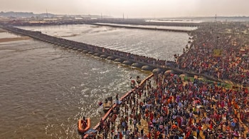 Hindu devotees gather to take a holy dip in the Sangam in Prayagraj